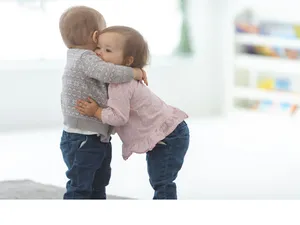 Toddlers Hugging