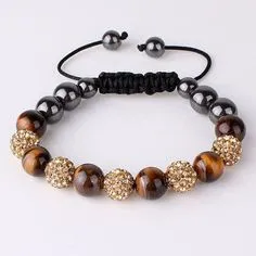 Gold and earth tone beads on black cord with silver trim.