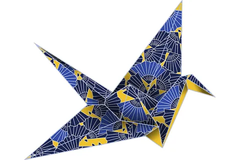 Origami paper crane made with double-sided paper.